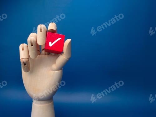 Preview: Wooden hand sculpture holds a red checkbox with a tick symbol on a blue background