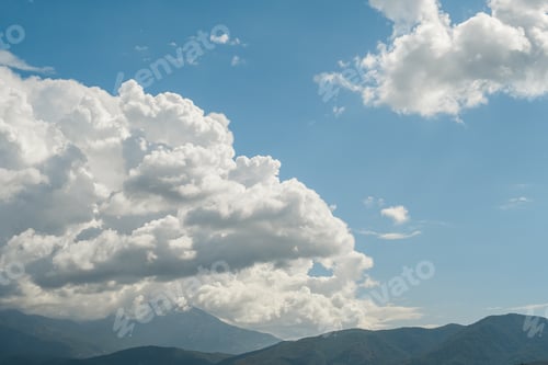 Preview: Beautiful view of the mountains and cumulus clouds on the Aegean Sea
