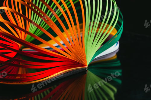 Preview: colored quilling paper curves on black