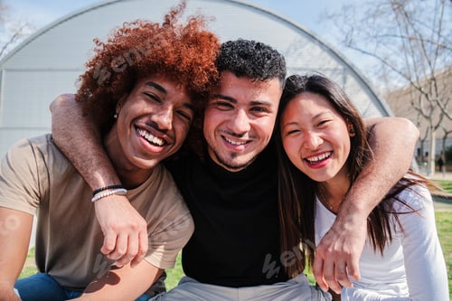 Preview: Portrait of a group of teenage students smiling and bonding at university campus. Three multiracial