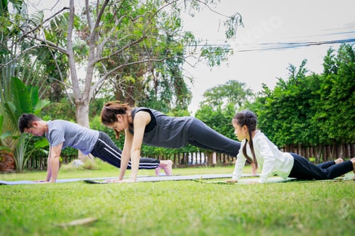 Preview: Fit happy people working out outdoor. Family Asian parent and child daughter exercising together