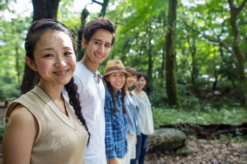 Preview: Group of friends at an outdoor party in a forest.