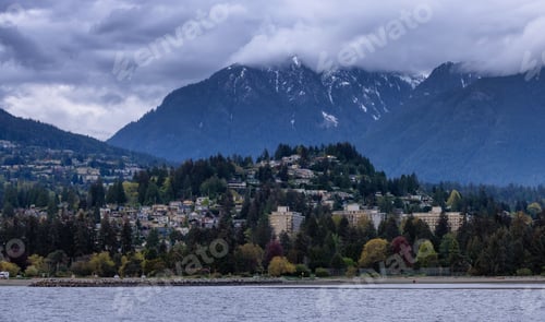 Preview: Residential Homes in a modern city with mountain landscape in background.