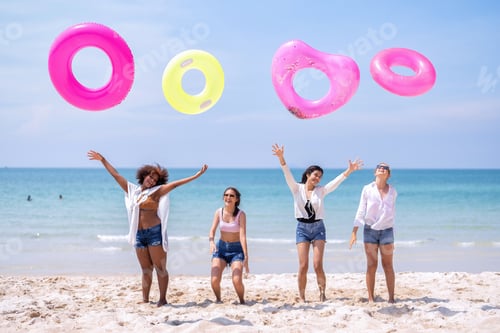 Preview: Teenage girl friendship enjoy laughing play on the blue sky sea and run to get water inflation toy