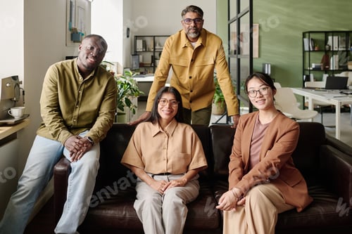Preview: Smiling Team Posing Together in Modern Office Space