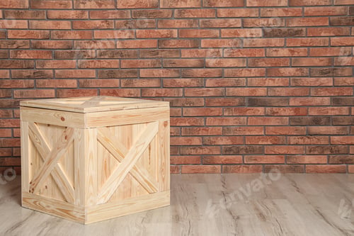 Preview: Wooden crate on floor at brick wall. Space for text