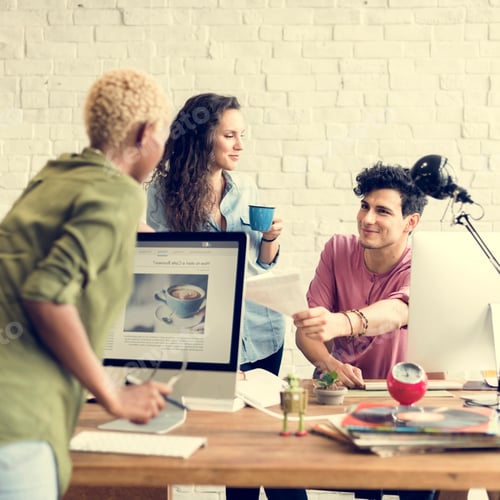 Colleagues Working Together in a Bright Office