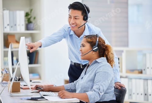 Preview: Young asian call centre telemarketing agent training new african american assistant on a computer i