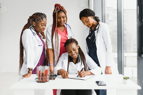 Preview: group of young african medical workers on white background.
