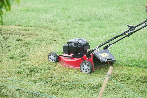 Preview: slow motion of Lawn mower on grass in garden,