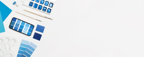 Preview: Classic Blue paints and paint brushes white background with space for text.