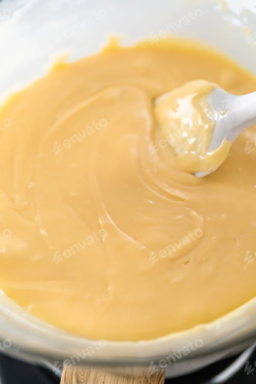 Preview: Smooth Caramel Being Stirred in Bowl Close-up