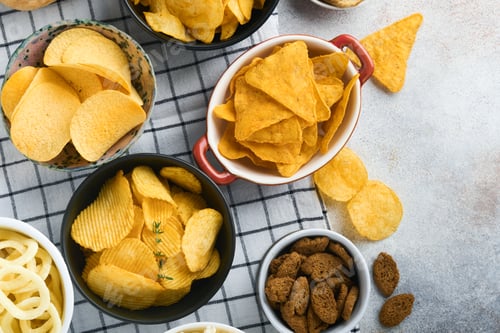 Preview: Snacks. Unhealthy food. All classic potato snacks with peanuts, popcorn and onion rings and salted p