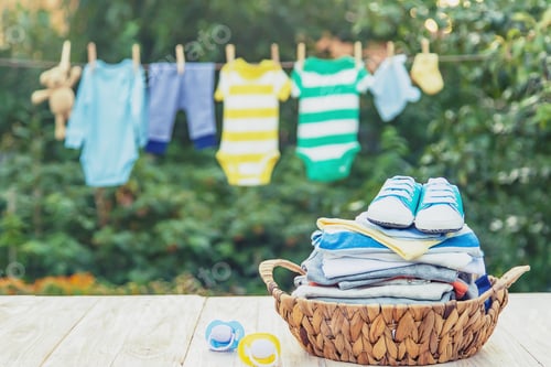 Preview: washing baby clothes. Linen dries in the fresh air. Selective focus.