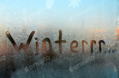 Preview: Winter frozen window. Creative spelling of the word Winter, means cold and freezing. Frosty pattern