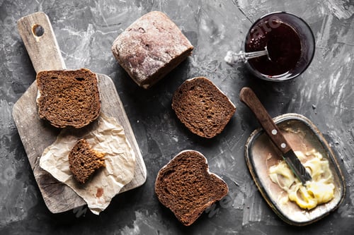 Preview: Bread with butter and jam in vintage style on a dark background