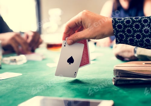 Preview: Adults playing cards and socialising