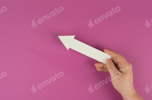 Preview: Holding an arrow in the hand, symbol for growth, success and development
