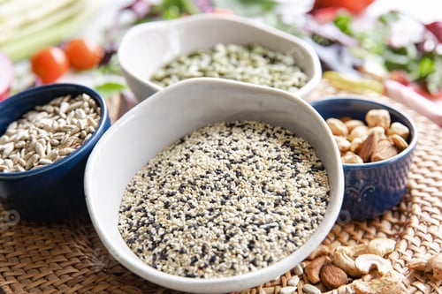 Preview: Close-up, a bowl of chia seeds and other healthy foods on the kitchen table.