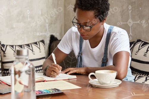 Preview: People, ethnicity and work concept. Black female manager works freelance from home, writes informati