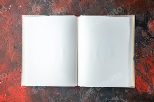 Preview: Overhead view of open and empty spiral notebook on dark background