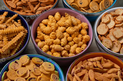 Preview: Colorful bowls with a variation of traditional Krichlate spicy miniature shortbread cookies