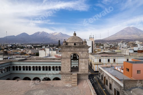 Preview: A centuries old church in the heart of Arequipa, with two massive volcanoes in the background