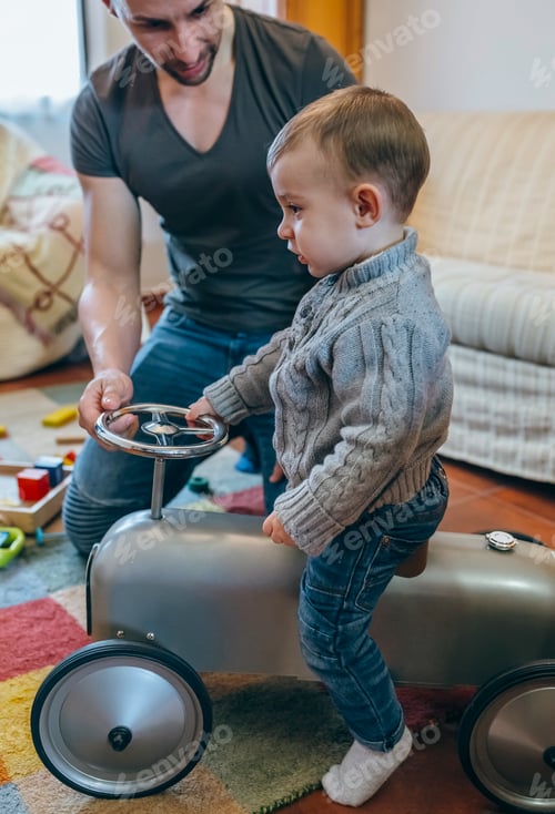 Preview: Father teaching his son how to drive small racing car