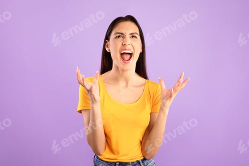 Preview: Frustrated Woman Yelling with Arms Raised