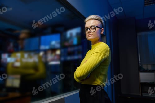 Preview: Portrait of young and successful female datacenter worker looking at camera