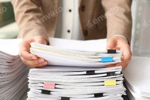 Preview: Woman working with documents in office, closeup