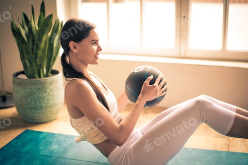 Preview: Sportive woman training at home