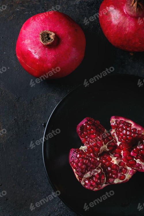 Preview: Slice and whole pomegranates