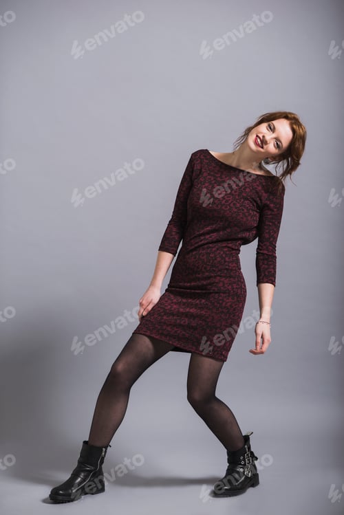 Preview: Portrait of smiling young woman in dress