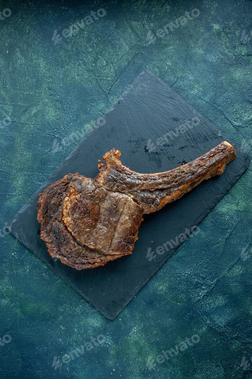 Preview: top view fried meat slice on a dark blue background meat food dish dinner barbecue fry color
