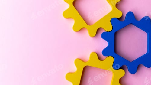 Preview: Interlocking gear shapes on a pink background.