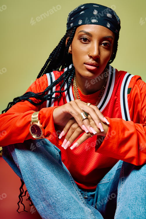 Preview: In a lively atmosphere, a young woman showcases her unique style with a playful expression.