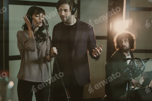 Preview: young singers performing song while man playing piano on background