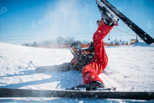 Preview: Skier in helmet and glasses lies on snowy mountain