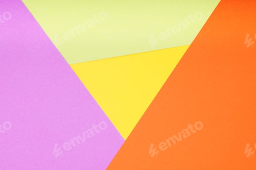 Preview: multicolor paper background with 4 different colors in triangle and rhombus shapes