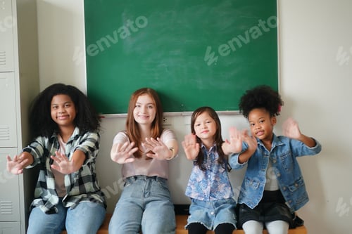 Preview: Happy little Girls against Chalkboard With Back To School