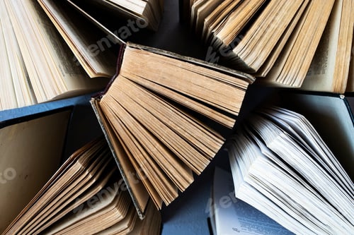 Preview: Old shabby thick books. View from above.