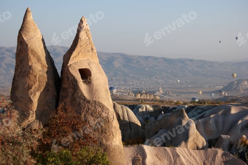 Preview: Big stone formations with flying hot air balloons.