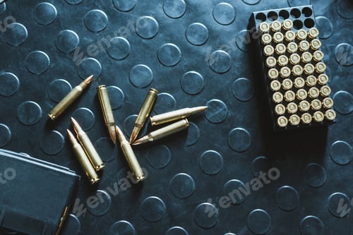 Preview: top view of rifle bullets and magazine on table