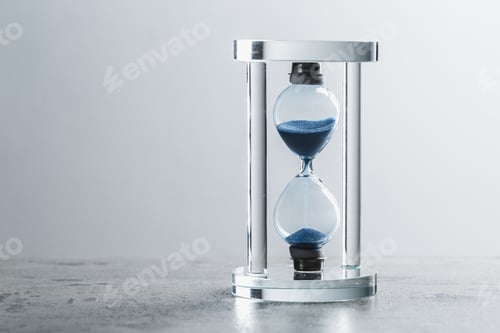 Preview: Close up hourglass on table