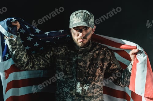 Preview: soldier with united states flag isolated on black