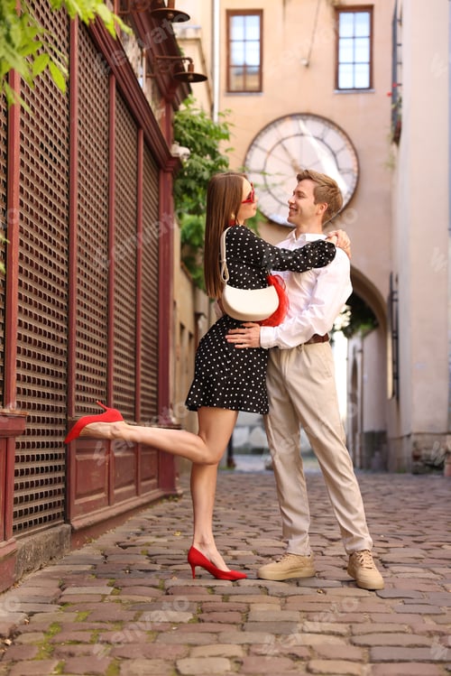 Preview: Lovely couple walking together on city street