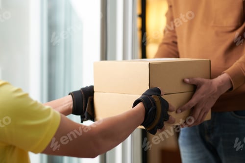 Preview: Man getting the parcel in box