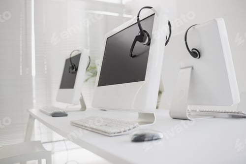 Preview: Computers And Headsets In Empty Office