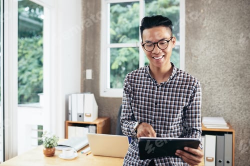 Preview: Entrepreneur Working on Tablet Computer